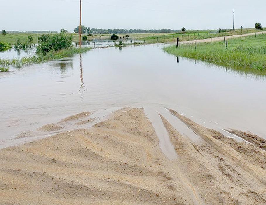 The road near the Larry Duden place was flooded, effectively closing it to traffic until the water receded.