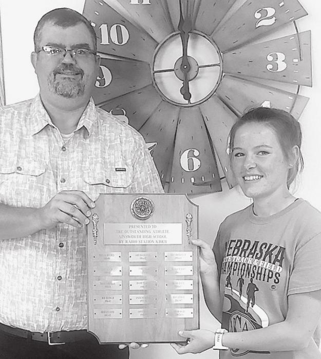 CeeAnna Beel (right) was named the KBRB AHS Athlete of the Year for 2020-21 by KBRB owner Graig Kinzie (left).