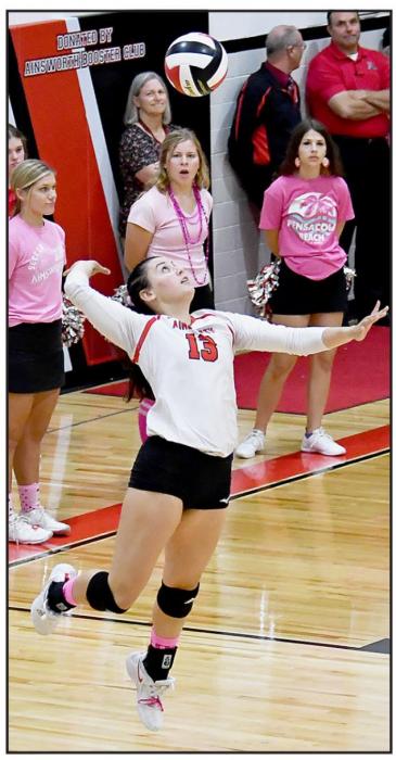 Dakota Stutzman (#13) sends a jump serve over the net to the North Central Knights.