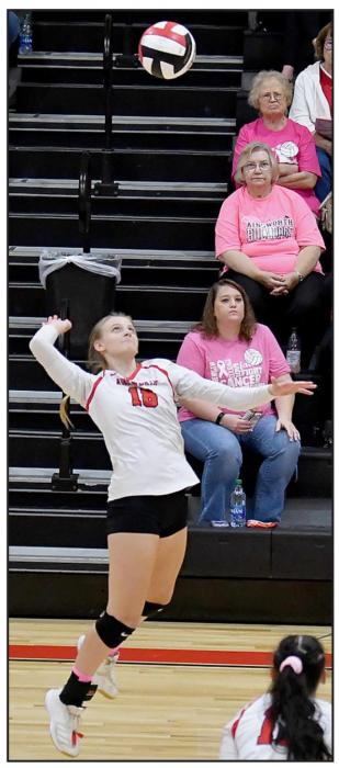 Madelyn Goochey (#18) zones in on the ball moments before completing a kill against North Central. M. Goochey had a total of 8 kills on the night; 4 in each match.