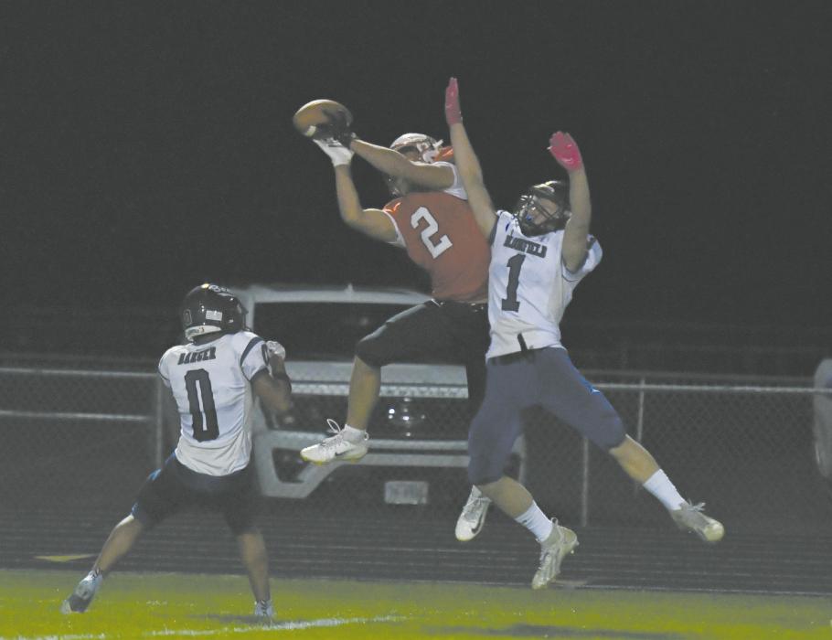 Junior Zaine Evans (2) makes a leaping catch during the last home game of the season. He made the catch and landed just short of the endzone.
