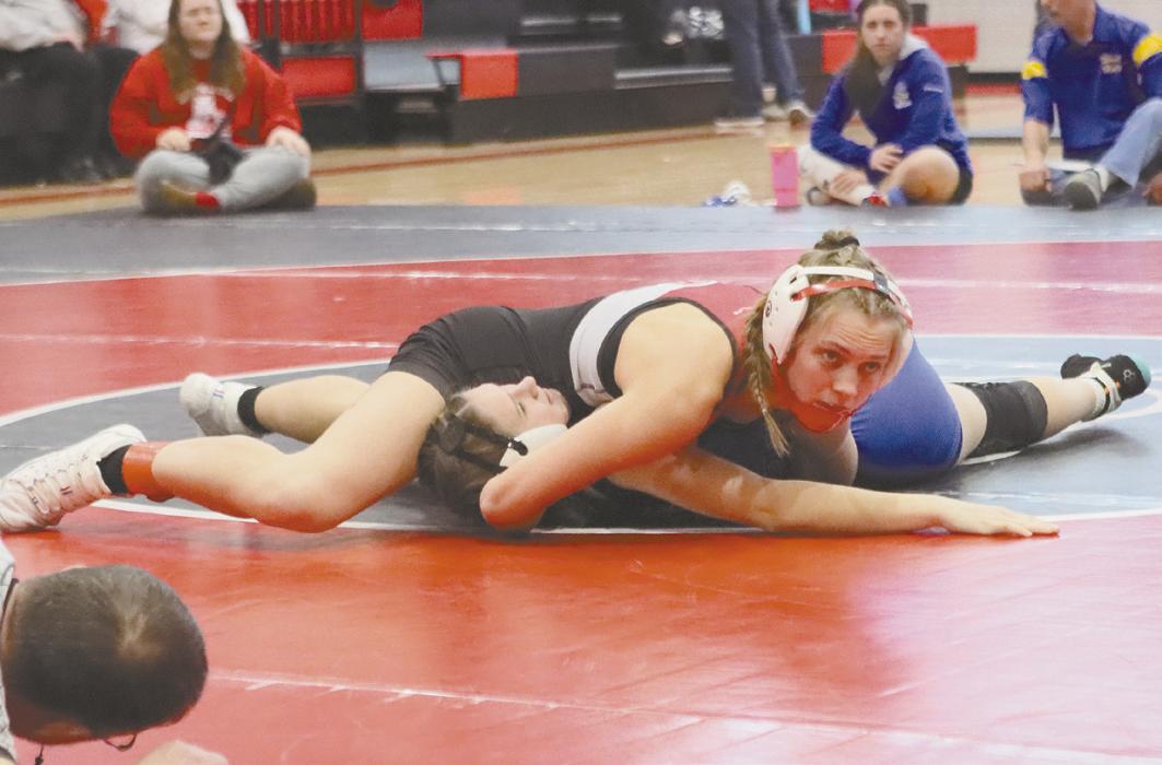Megan Jones waits for the ref to call her pin during the Ainsworth tournament.