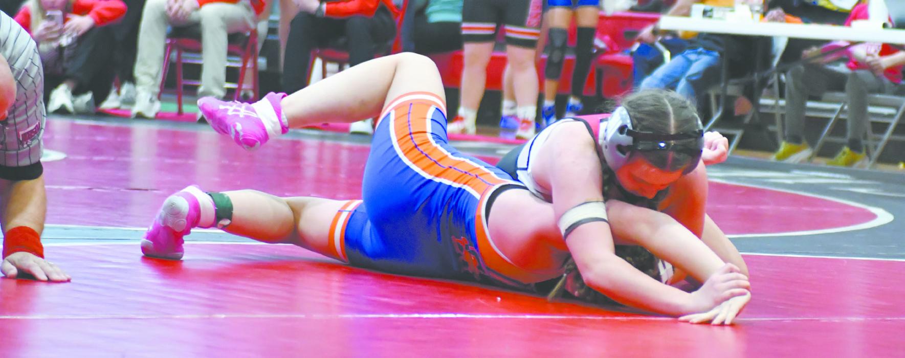 Freshman Makenna Koch works to pin her opponent, McKenzie Simonson of Gordon-Rushville. Koch placed fourth at the Ainsworth Girls Wrestling Invitational.