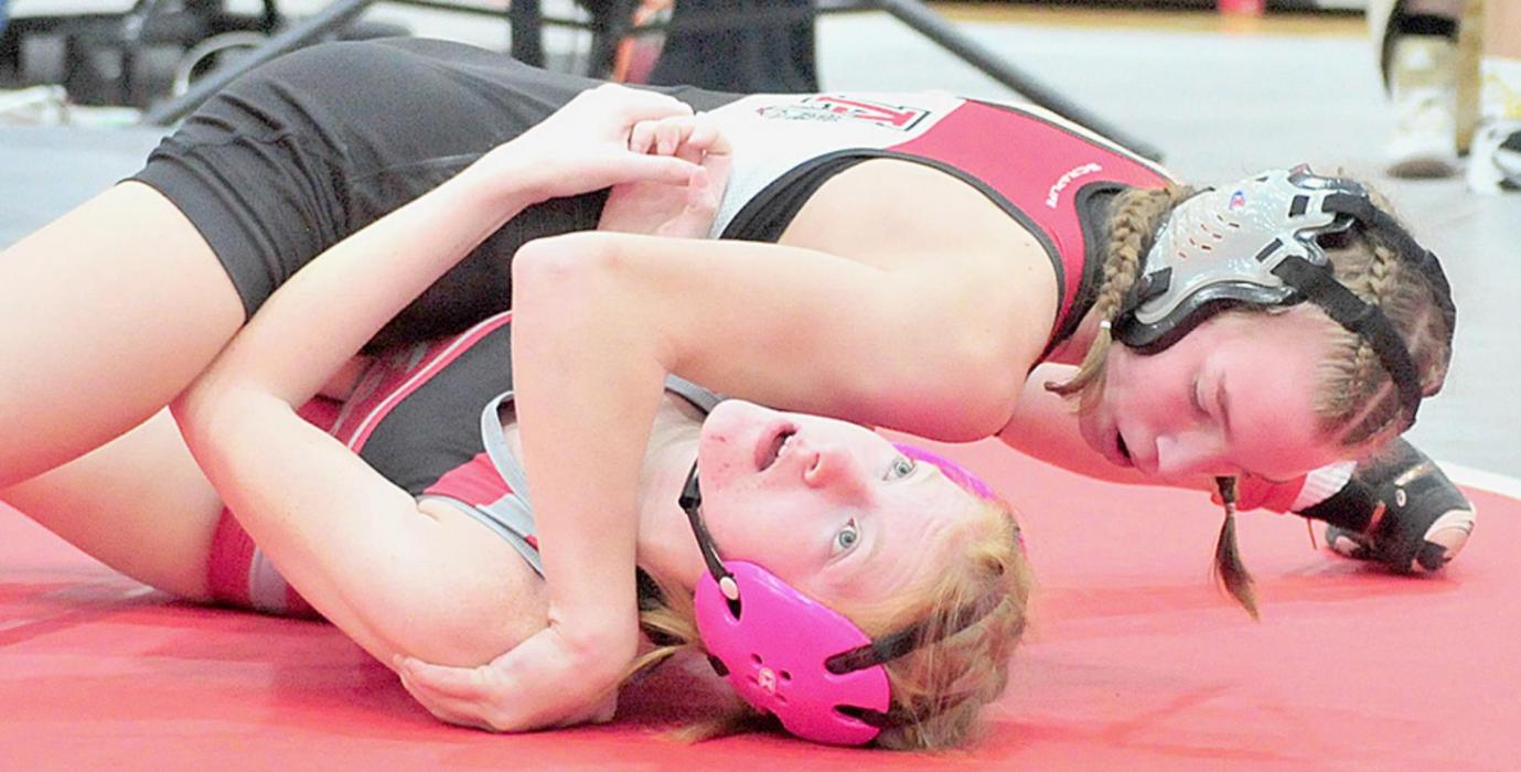 Jolyn Pozehl pinned all three of her opponents in the 114 lb. weight class at the Amherst Invitational to take first place.