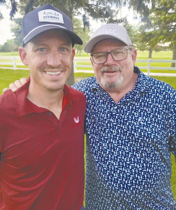 Brandon Beebout (left) and Bruce Beebout won the championship flight of the 10th annual Memorial Golf Tournament Saturday at the Ainsworth Golf Course, played in memory of Al Hansen. The Beebouts finished ahead of the 27 other teams competing.