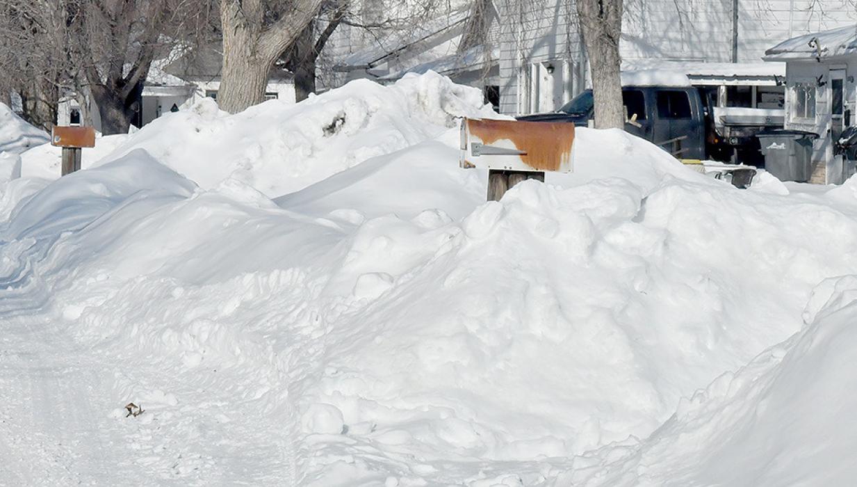 With nearly 50 inches of snowfall to date in Ainsworth, it is getting tough to find places to put all the snow when cleaning driveways, streets and sidewalks. Residents are reminded that if they want mail delivery, the snow needs to be removed from the front of mail boxes, illustrated by the picture below.
