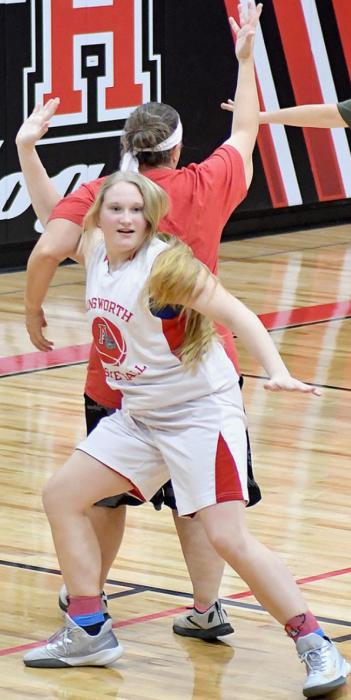 Sandi Nelson tries unsuccessfully to post up against 8th Grade defender Addah Booth.