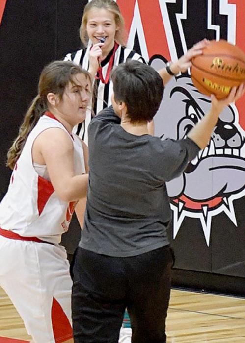 7th Grader Willa Flynn stops ACS Teacher Nicole Flynn from scoring underneath the basket.