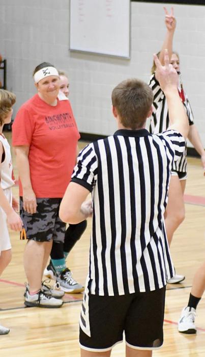 The referees (AHS basketball players Bria Delimont and Carter Nelson) call a shooting foul on S. Nelson.