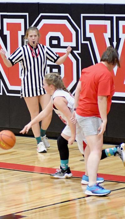 The ref calls a foul on ACS Teacher Manda Evans for her illegal body check against Kinsey Walz.