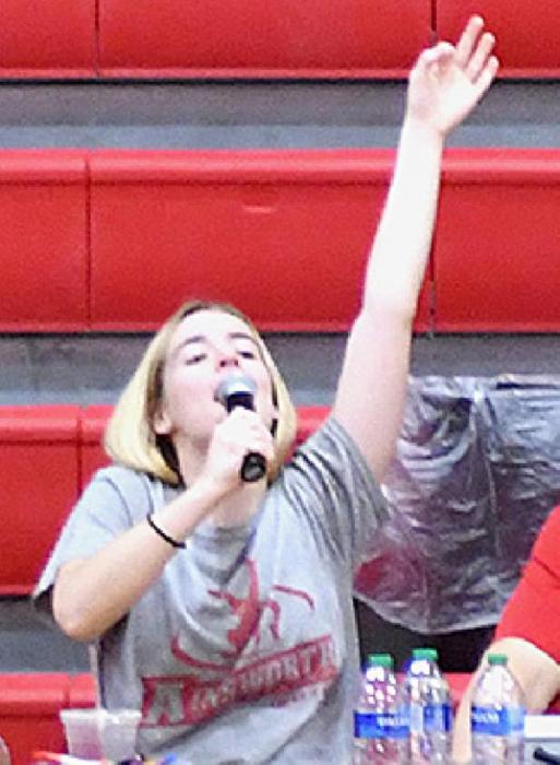 The game was announced by AHS sophomore Cheyan Temple, who declares a staff three-pointer above.