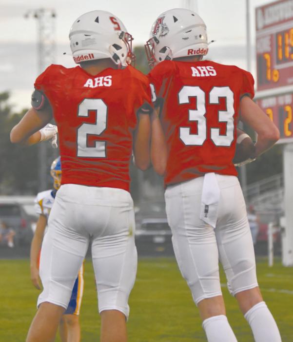 Sophomores Jacob Ortner (right) and Zaine Evans (left) celebrate after Ortner scores a touchdown.