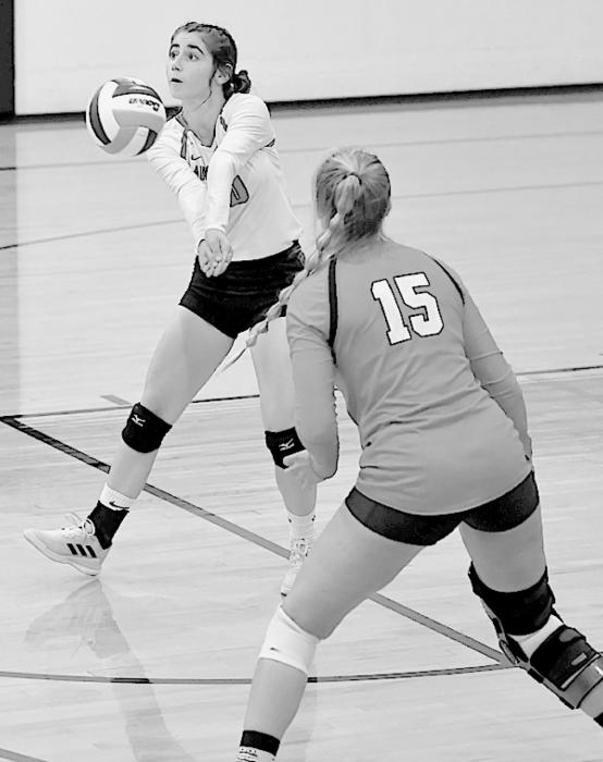 Above, Maia Flynn passes the ball during the Bulldogs’ win on September 9th. She had nine digs and five serve receive passes against the CWC Renegades.