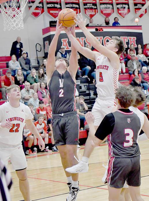 Traegan McNally and Seth Vavra compete for a rebound in the first half. Ainsworth defeated Valentine in overtime, 60-52.