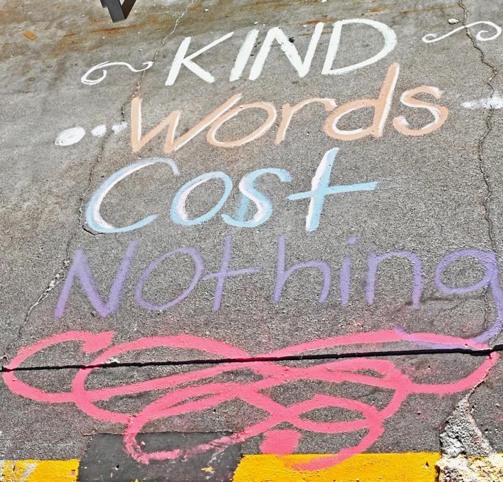 At the entrance to the Sandhills Care Center, Alexia Schiermeyer created this colorful drawing that says, “Kind Words Cost Nothing.”