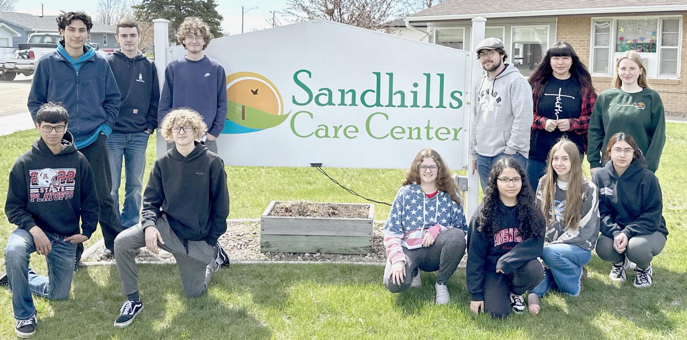 Ainsworth Art Club Paints Windows at Sandhills Care Center