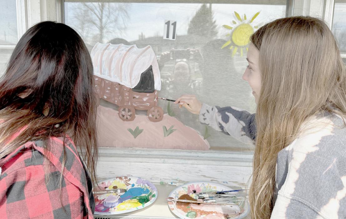 Ainsworth Art Club Paints Windows at Sandhills Care Center