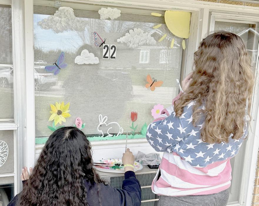 Ainsworth Art Club Paints Windows at Sandhills Care Center